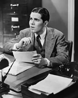 Paper Material Prints: Office worker sitting at desk (B&W)