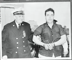 Robbery Prints: Officer Escorting Jordan Perry