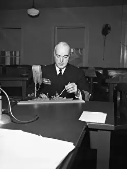 Model Ship Prints: Officer Pointing at Ship Model