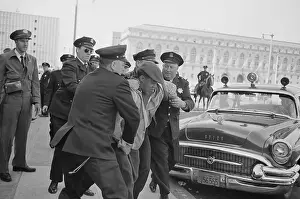 Oppression Prints: Officers Detaining Unidentified Man
