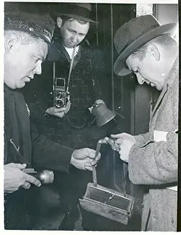 Wisconsin Prints: Officers Examining Handbag