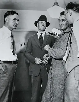 Officers Guarding a Prison Inmate