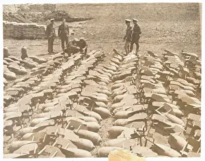 Officers Inspecting Aerial Bombs