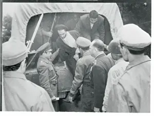 Tehran Prints: Officers Removing a Prisoner from a Truck