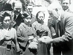 Officials Looking over Passports of Japanese Brides