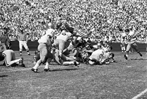 Simpson Prints: O.J. Simpson Goes Over Opposing Team