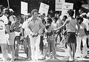 Simpson Prints: O.J. Simpson Amongst People Picketing for NFL Players