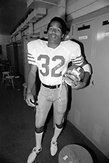 San Jose Prints: O.J. Simpson Tries on His 49'ers Uniform for the First Time
