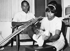 Simpson Prints: O.J. Simpson's Wife Applies an Ice Pack to His Foot