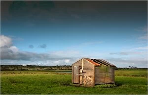 Old and abandoned farm hut in the rurals of King Island, Bass Strait, Tasmania, Australia