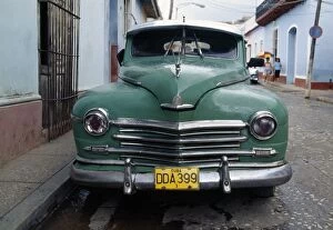 Havana Gallery: Old blue car parked in street, Havana, Cuba