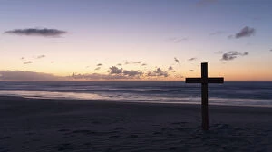 Images Dated 16th December 2014: An old cross on sand dune next to the ocean with a calm sunrise - Arniston, South Africa