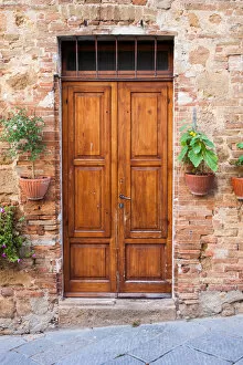 Wooden Gallery: Old elegant wooden door in italian village