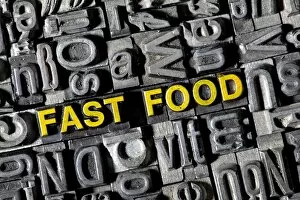 Old lead letters forming the word fast food