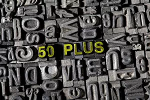 Old lead letters spelling the word 50 PLUS