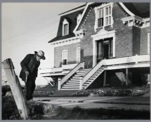 Old Man In Front Of House