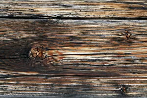 Detail of an old natural wood house front