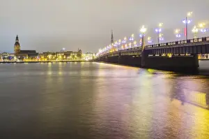 Riga Prints: Old Riga skyline at night and Akmens bridge over Daugava river. Riga, Latvia