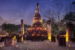 Images Dated 2nd April 2015: Old stupa with candlelight and milky way galaxy in the Kamphaeng Phet Historical Park