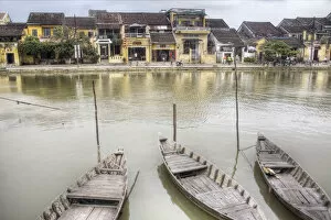 old town on river wooden boats