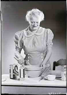 Baking Prints: Old Woman Cooking And Smiling