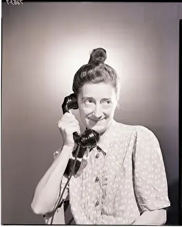 Old Woman Using Telephone