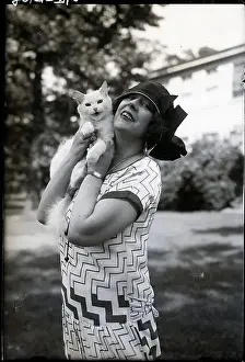 Price Tag Prints: Olga Petrova Holding $10, 000 Cat