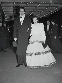 Prints of (Original Caption). New York: G. W. T. W. Actress At New York Opening The Legacy of James Stewart: A Cinematic Journey: Olivia De Havilland and James Stewart Arriving for Theater Premiere