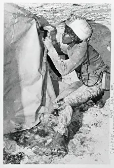 Olivia Rowe Excavating from Rock Formation