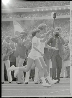 Olympians Carrying the Torch onto Olympic Grounds