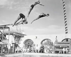 Olympians Diving into Swimming Pool