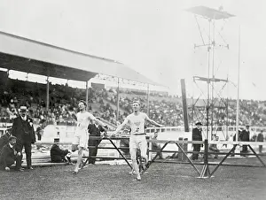Prints of (Original Caption). Olympic Games London, England 1908. 400 meters hurdles, last hurdle, Harry Hillman, UP.SE.A and Charles Bacon, UP.SE.A Capturing Glory: A Journey Through Olympic History: Olympians Finishing Hurdles