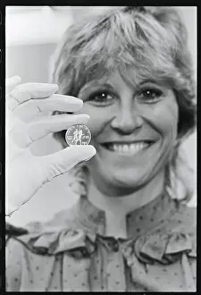 Olympic Gold Medalists Holding Gold Coin