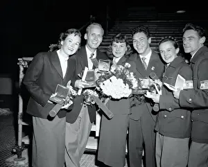 Olympic Pair Figure Skaters Holding Their Medals