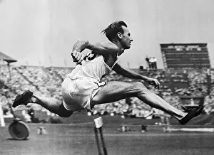 Runner Prints: Olympic Runner Roy Cochran in Hurdles Qualifying Race