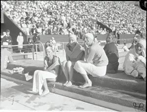 Tiredness Prints: Olympic Swimmers Resting Poolside