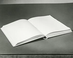 Open blank book on table