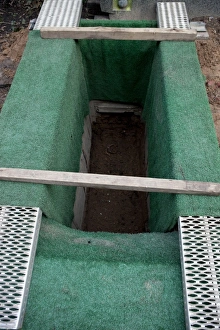 Lawn Collection: Open grave in a cemetery