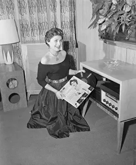 Opera Singer Roberta Peters While Playing Record Albums