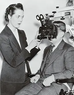 Optometrist Prints: Optometrist Examining a Patient