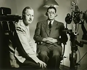 Only Mature Men Prints: Optometrist with patient in office