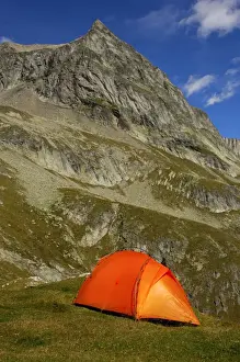 Mountain Top Prints: Orange-coloured mountain tent below the summit of Wiwanni Mountain in the Pennine Alps