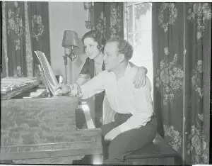 Orchestra Director Raymond Paige with His Wife at Piano