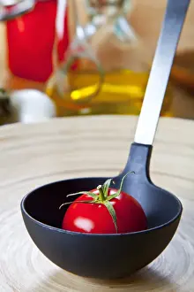 Tomatoes Prints: Organic tomato in a soup ladle