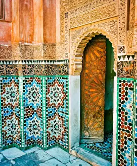 Ornate Tiled Wall and Open Wooden Door in Marrakech Morocco