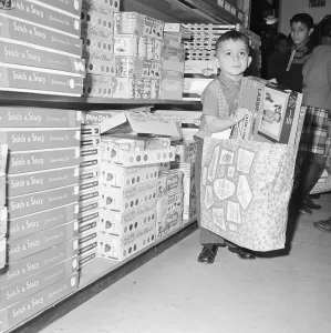 Orphan Prints: Orphan Boy Carrying Bag of Toys