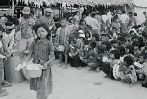Starvation Prints: Orphaned Children Waiting for Rice