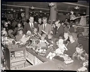 Counter Prints: Orphans at Gimbels Touch Doll at Counter