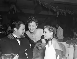 Orson Welles, Mrs. Jack Warner, and Lili Damita