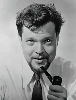 Orson Welles Smoking a Pipe
